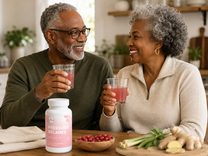 older couple enjoying pressure balance capsules while sitting at the kitchen table smiling
